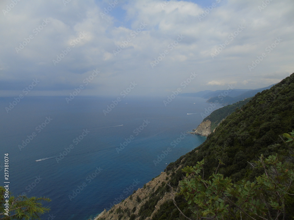 An amazing caption of the beautiful places from the 5 Terre in Liguria with an amazing blue sky and some green mountains in the background An amazing caption of the beautiful places from the 5 Terre in Liguria with an amazing blue sky and some green mountains in the background