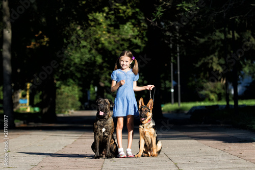 girl and dogs in the park