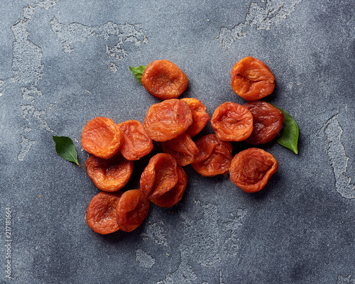 Dried apricots on gray background with copy space. Top view. photo