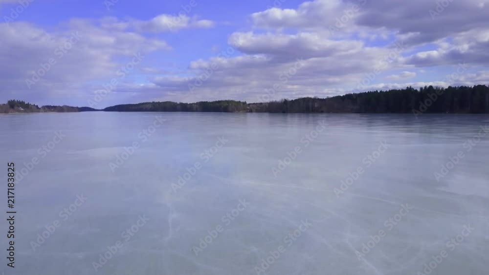 Aerial shot of a frozen lake during spring time Aerial shot of a frozen lake during spring time