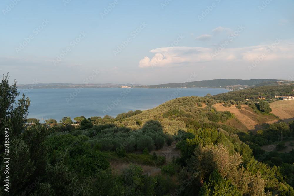 Panoramic view of the lake Bracciano (Italian: Lago di Bracciano), lake of volcanic origin in the Italian region of Lazio and important tourist attraction situated near Rome, drinking water reservoir Panoramic view of the lake Bracciano (Italian: Lago di Bracciano), lake of volcanic origin in the Italian region of Lazio and important tourist attraction situated near Rome, drinking water reservoir