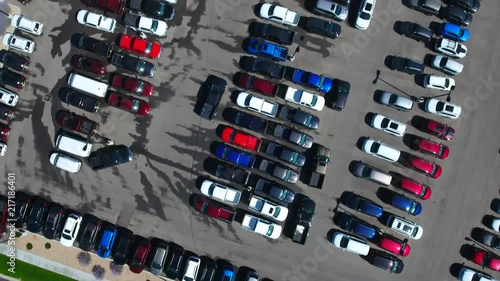Aerial looking down over a car dealership parking lot