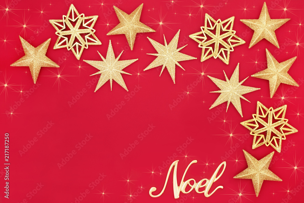 Christmas abstract with glitter star bauble decorations and gold noel sign on red background with copy space. Traditional festive card for the Christmas holiday season. Christmas abstract with glitter star bauble decorations and gold noel sign on red background with copy space. Traditional festive card for the Christmas holiday season.