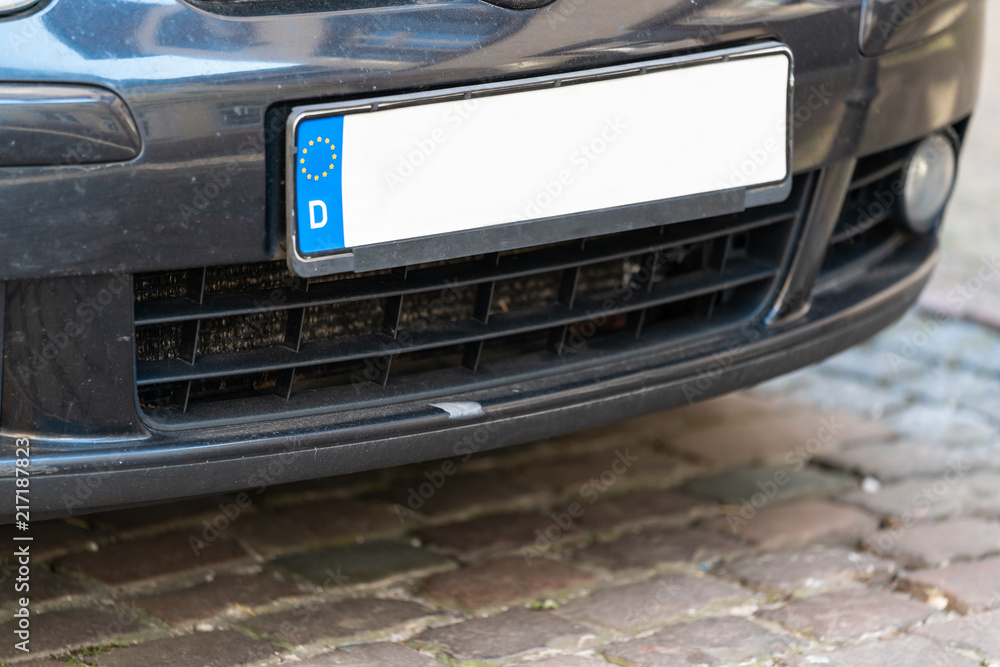 Close-up Of A Empty White Number Plate On dark Car.
Blank Euro License Plate On a Car.