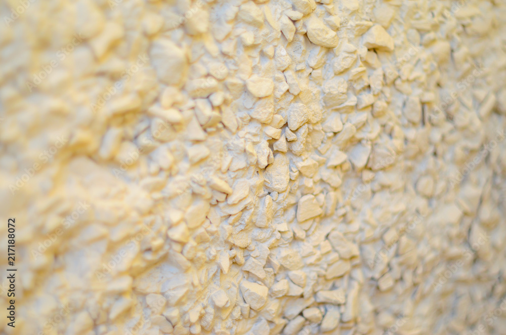 Pebble Plaster Wall Background. Fine Gravel in the Finish of the Wall Abstract Blank Background Pebble Plaster Wall Background. Fine Gravel in the Finish of the Wall Abstract Blank Background