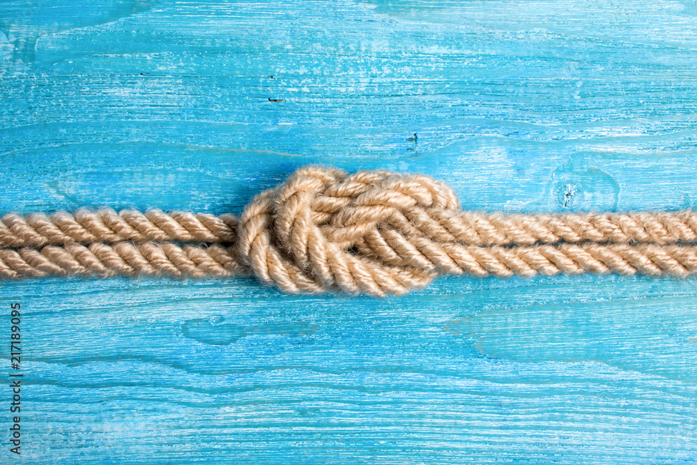 Fototapeta premium Rope, knot and background wood