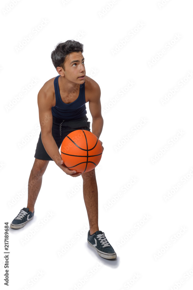 Teen sportsman with sportswear playing basketball. White background.