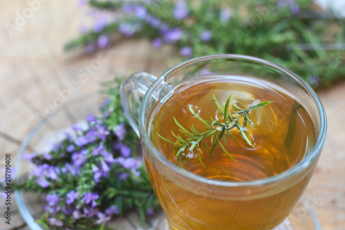 Cup of fresh natural tea on wooden table. Thymus serpyllum natural tea, Breckland Thyme with cup of tea