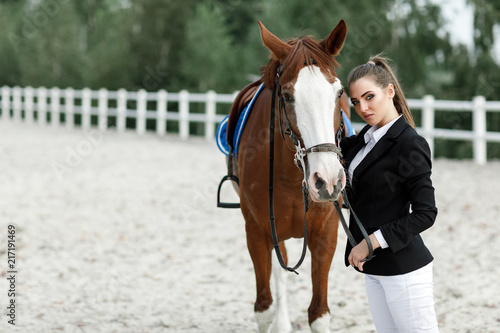 Rider elegant woman riding her horse outside