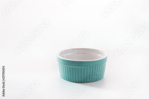 Porcelain souffle ramekin dish isolated on white background photo