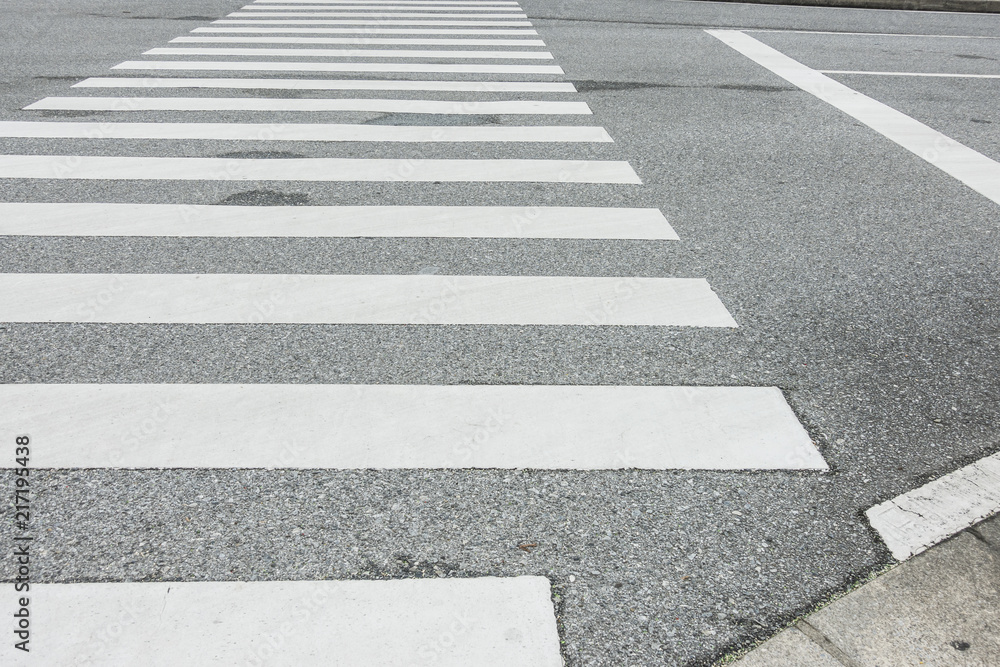 Zebra crosswalk on the road for safety when people walking cross the street, Pedestrian crossing, asphalt road, White lines and crosswalk on street background  