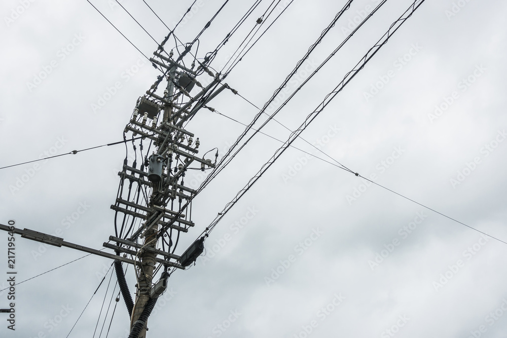 Electricity Pole with Cable Lines and the cloudy sky backdrop, Power Utilities with Pole in Thailand Electricity Pole with Cable Lines and the cloudy sky backdrop, Power Utilities with Pole in Thailand