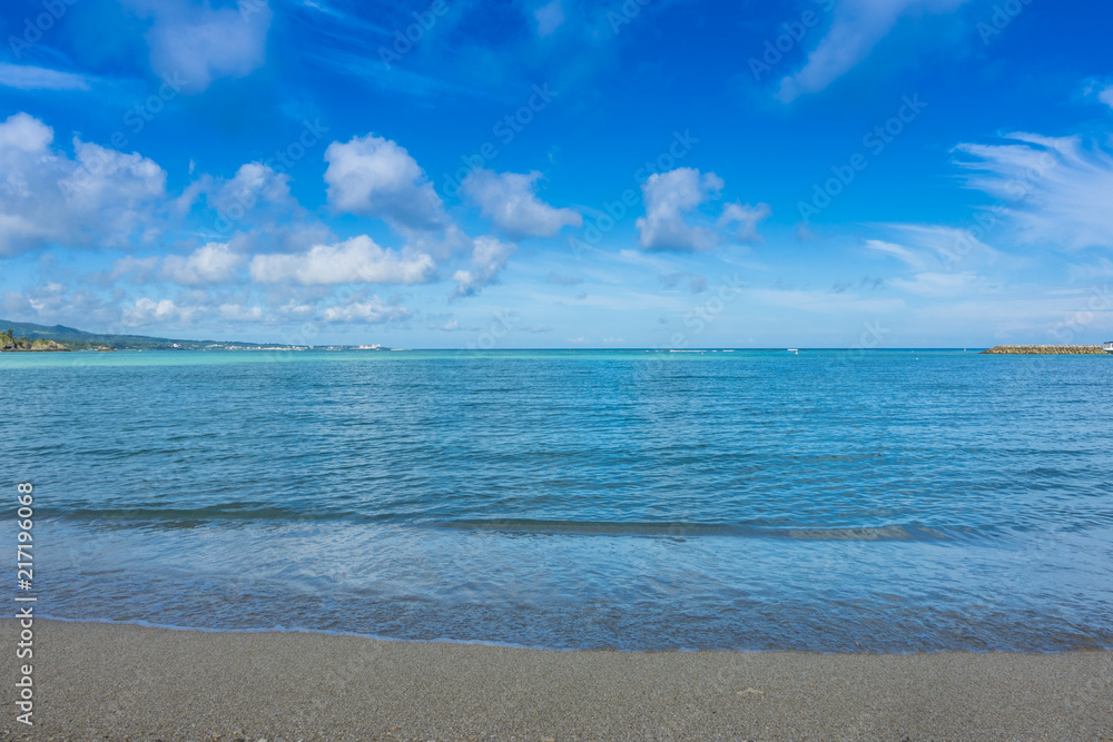 Obraz premium Sand Beach and sea for relaxation on holiday, Scenic view of sea with blue sky, Travel destination, nature sea view with sand beach, nature background, Tropical beach and Trquoise water in summer