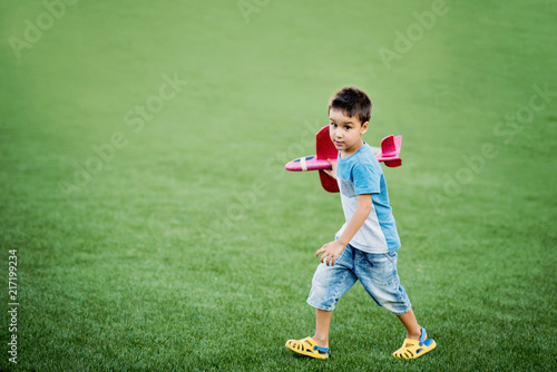 Boy playing with a plane