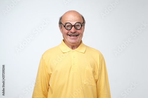 Portrait of a funny mature man in circle glasses © Viktor Koldunov