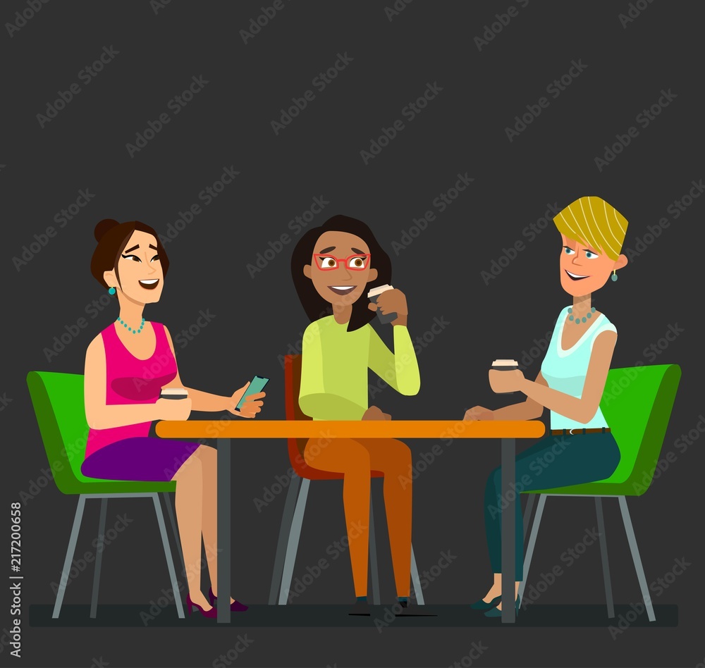 Three girls sitting at a table together talking to coffee break.