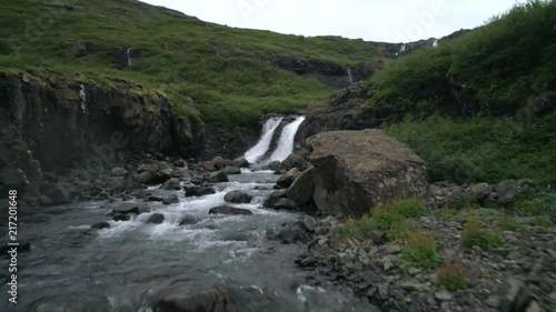 This is a waterfall in the fjord Mjóifjordur in the westfjords of Iceland photo