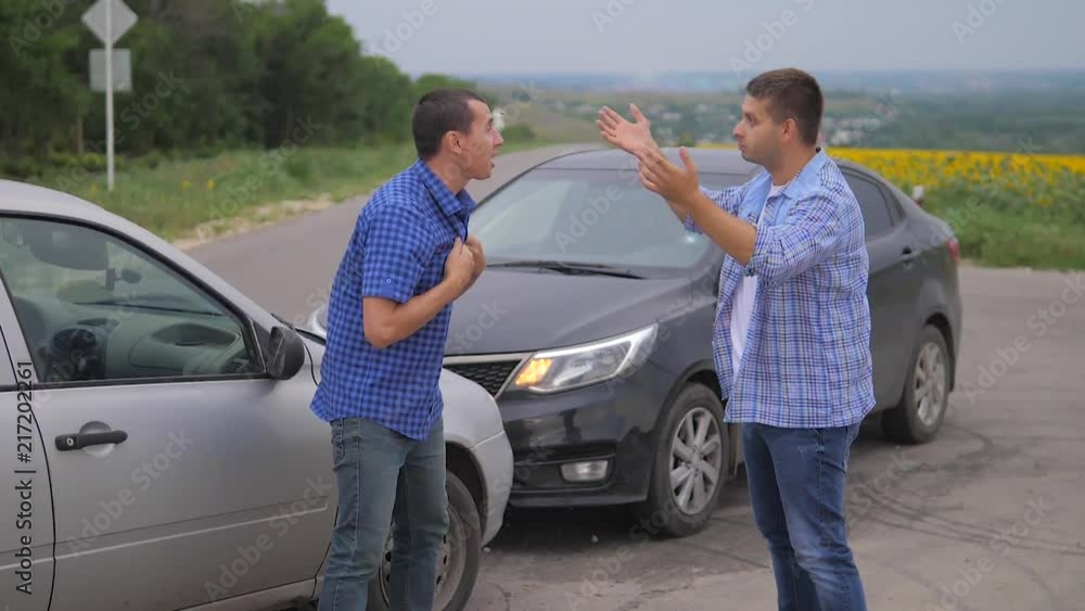 Two men arguing conflict after a car accident on the road car insurance. slow motion video lifestyle. Two Drivers man Arguing After Traffic Accident. auto insurance accident concept men Two men arguing conflict after a car accident on the road car insurance. slow motion video lifestyle. Two Drivers man Arguing After Traffic Accident. auto insurance accident concept men