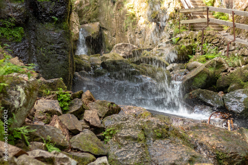 MENZENSCHWAND, GERMANY - JULY 23 2018: Waterfall in the German village Menzenschwand on a beautiful sunny summer day