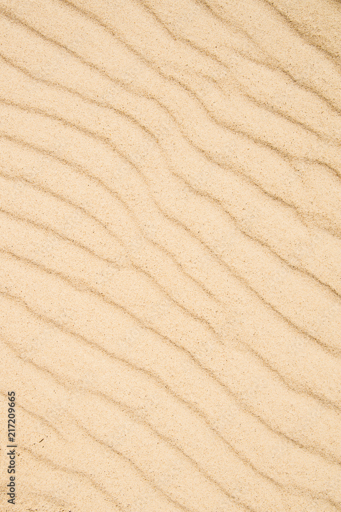 Sand of a beach with wave patterns Sand of a beach with wave patterns