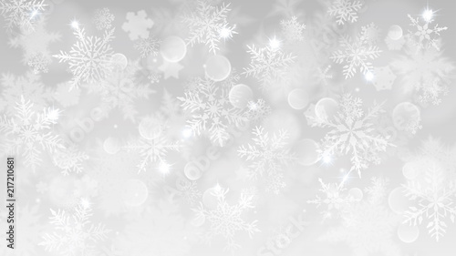Christmas illustration with white blurred snowflakes, glare and sparkles on gray background