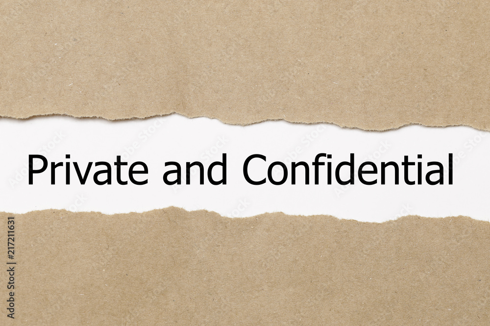 The word Private and confidential appearing behind torn paper. The word Private and confidential appearing behind torn paper.