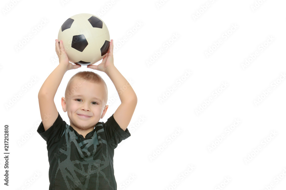 The little boy with the ball in his hands