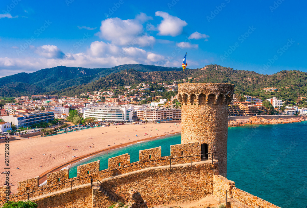Sea landscape Badia bay in Tossa de Mar in Girona, Catalonia, Spain near of Barcelona. Ancient medieval castle with nice sand beach and clear blue water. Famous tourist destination in Costa Brava