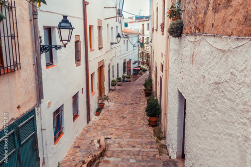 Street in Girona, Catalonia, Spain. Scenic and colorful ancient town. Famous tourist resort destination, perfect place for holiday and vacation.