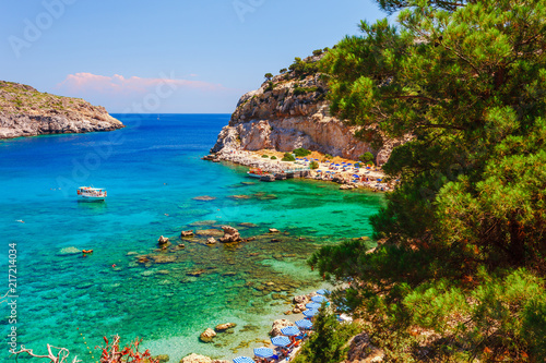 Fototapeta Naklejka Na Ścianę i Meble -  Sea skyview landscape photo Anthony Quinn bay near Ladiko bay on Rhodes island, Dodecanese, Greece. Panorama with nice sand beach and clear blue water. Famous tourist destination in South Europe