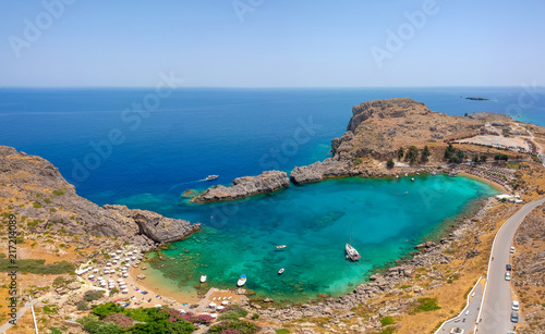 Aerial birds eye view drone photo Saint Paul bay near village Lindos, Rhodes island, Dodecanese, Greece. Sunny panorama with lagoon and clear blue water. Famous tourist destination in South Europe