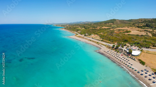 Aerial birds eye view drone photo beach on Rhodes island, Dodecanese, Greece. Panorama with nice lagoon and clear blue water. Famous tourist destination in South Europe © oleg_p_100