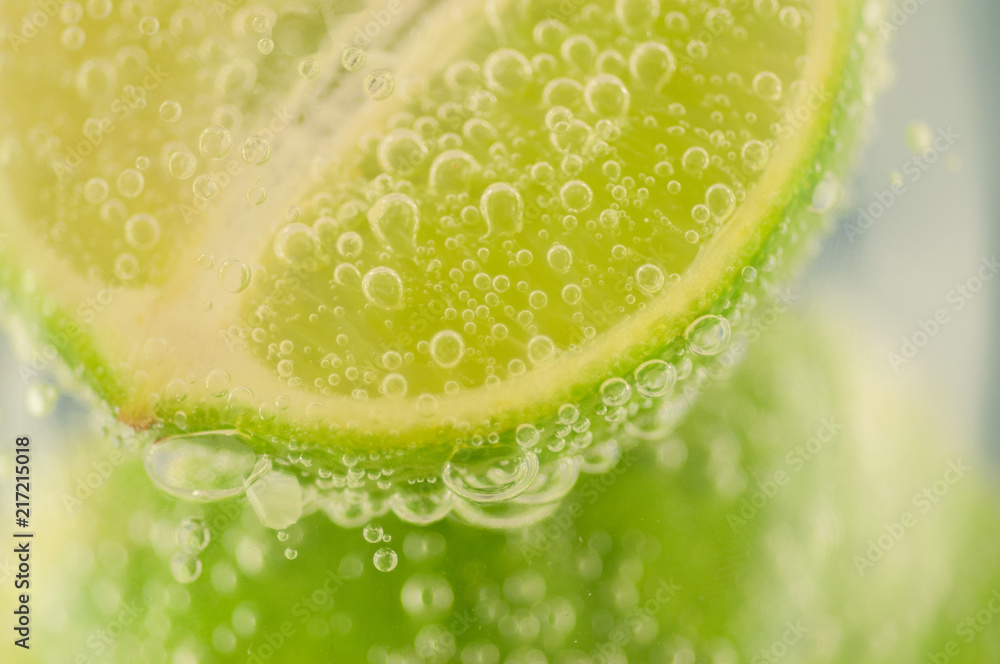 beautiful macro of lime and bubble water for a fresh cocktail beautiful macro of lime and bubble water for a fresh cocktail