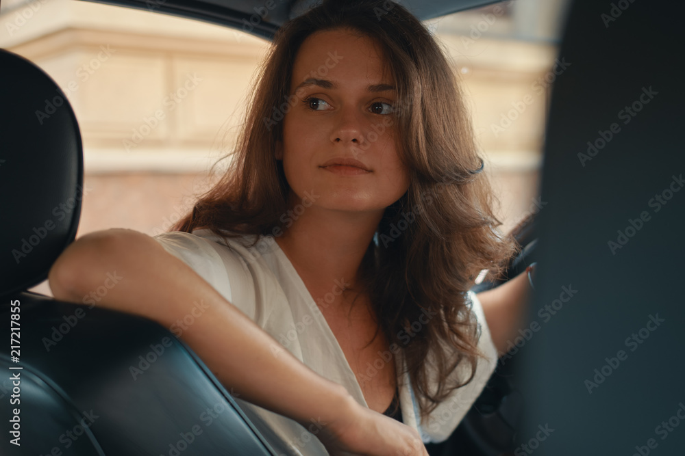 Close-up portrait of woman holding hand on steering wheel Close-up portrait of woman holding hand on steering wheel