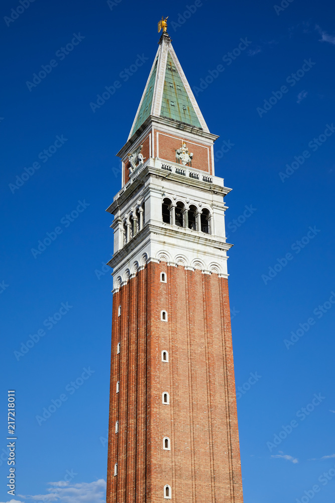 Saint Mark campanile, bell tower in Venice in a sunny summer day, blue sky