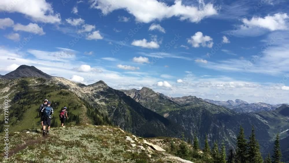 Hiking across mountain ridge. Hiking across mountain ridge.