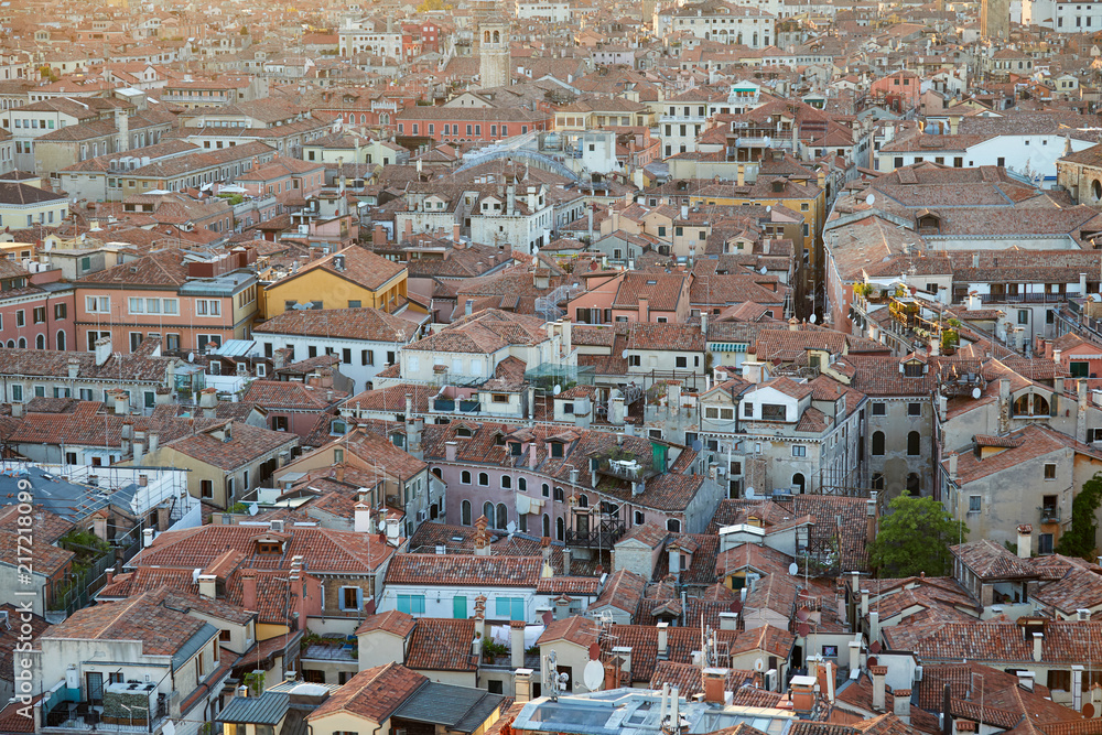 Aerial view of Venice roofs, city and buildings before sunset in Italy