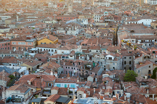 Aerial view of Venice roofs, city and buildings before sunset in Italy