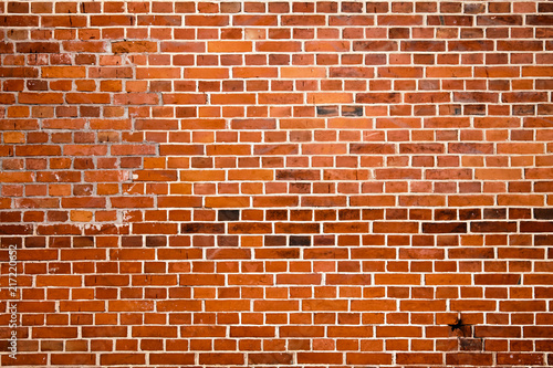 Blocks in a line background. Cracked red brick wall
