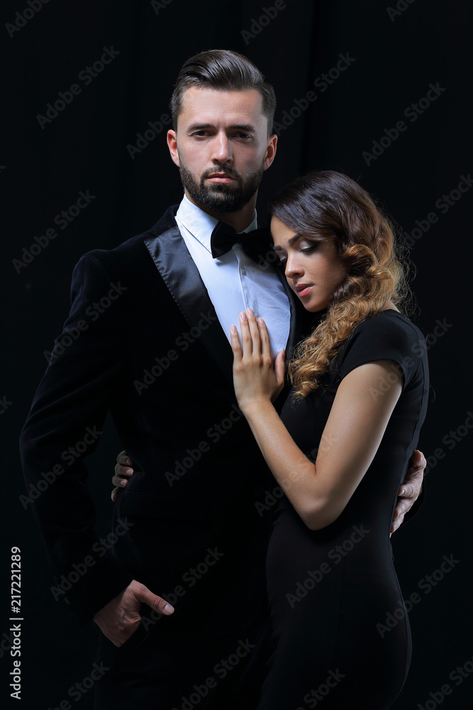 portrait of fashion couple on black background portrait of fashion couple on black background
