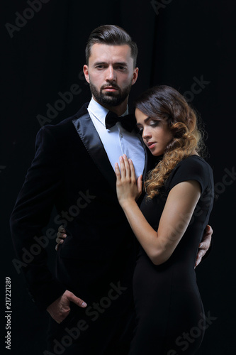 portrait of fashion couple on black background