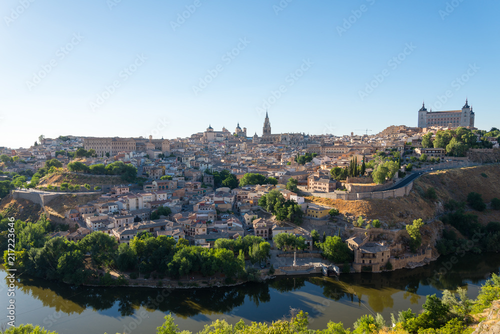 Panoramic scenery of the ancient historical city of Toledo which located on the hill and enclosed by Tagus river during summer season in Toledo, Spain.