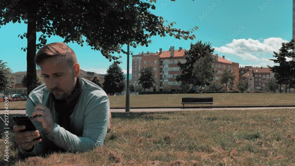 Artistic handsome man relax in city district park Artistic handsome man relax in city district park