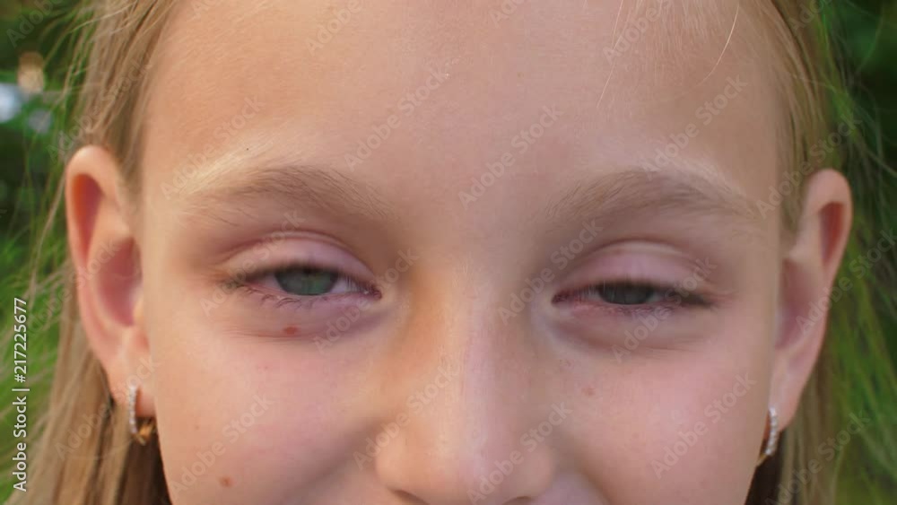 Adorable cheerful girl with green eyes, cropped view Adorable cheerful girl with green eyes, cropped view