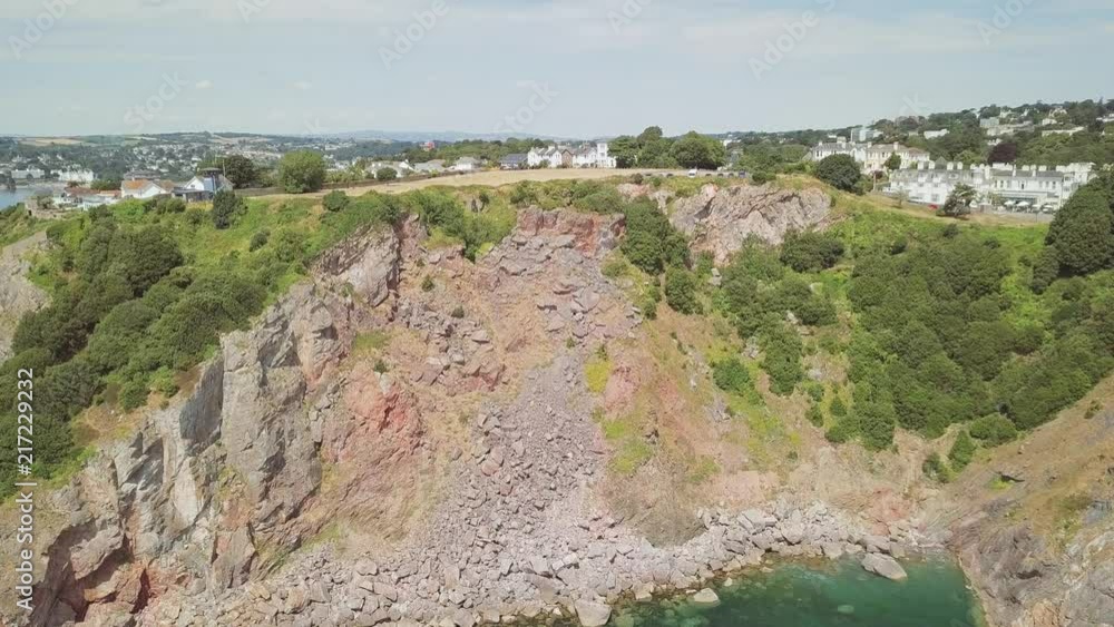Flying towards the cliffs and land of Torquay in England.