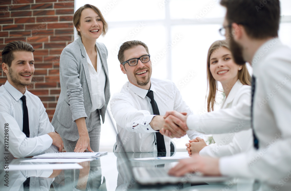 handshake financial partners at the Desk handshake financial partners at the Desk