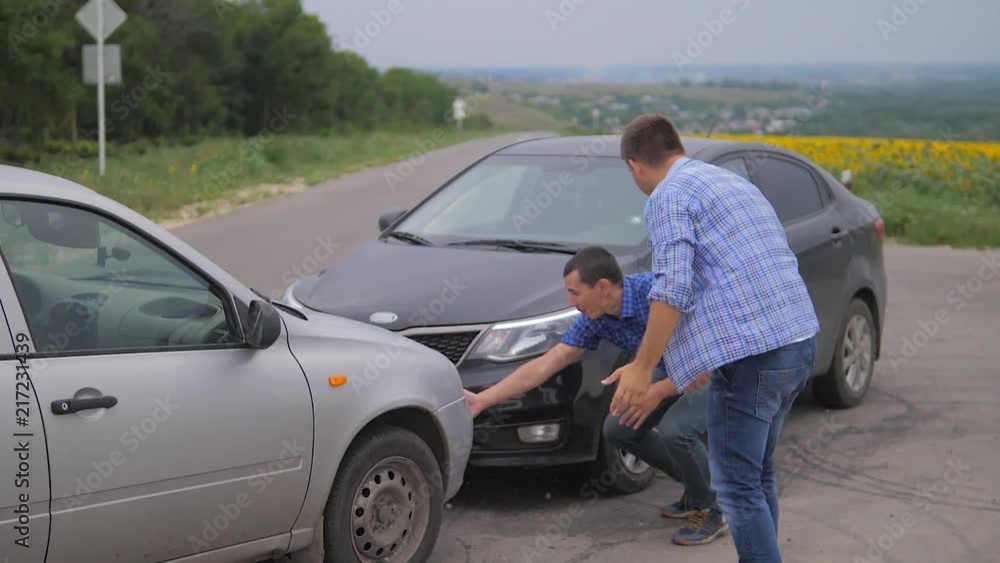 Two men arguing conflict after a car accident on the road car insurance lifestyle. slow motion video. Two Drivers man Arguing After Traffic Accident. auto insurance accident concept men Two men arguing conflict after a car accident on the road car insurance lifestyle. slow motion video. Two Drivers man Arguing After Traffic Accident. auto insurance accident concept men