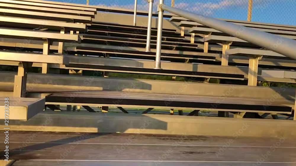 Slow movement through football stadium bleachers. Slow movement through football stadium bleachers.