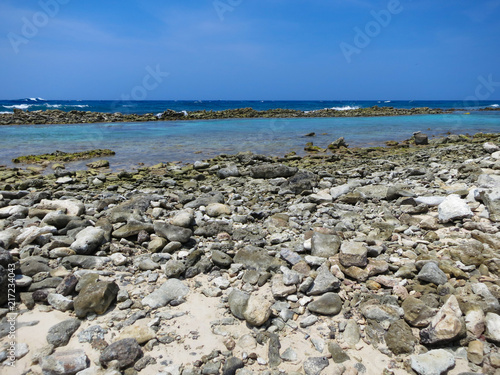 View of the Caribbean Sea across the rocks from Baby Beach in Aruba