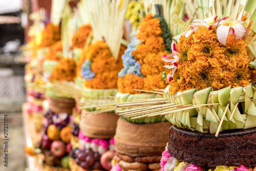 Traditional balinese offerings to Gods with fruits in basket.